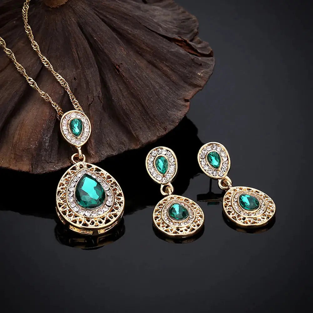 Red women jewelry set by Lamp Post featuring matching necklace and earrings with elegant design.