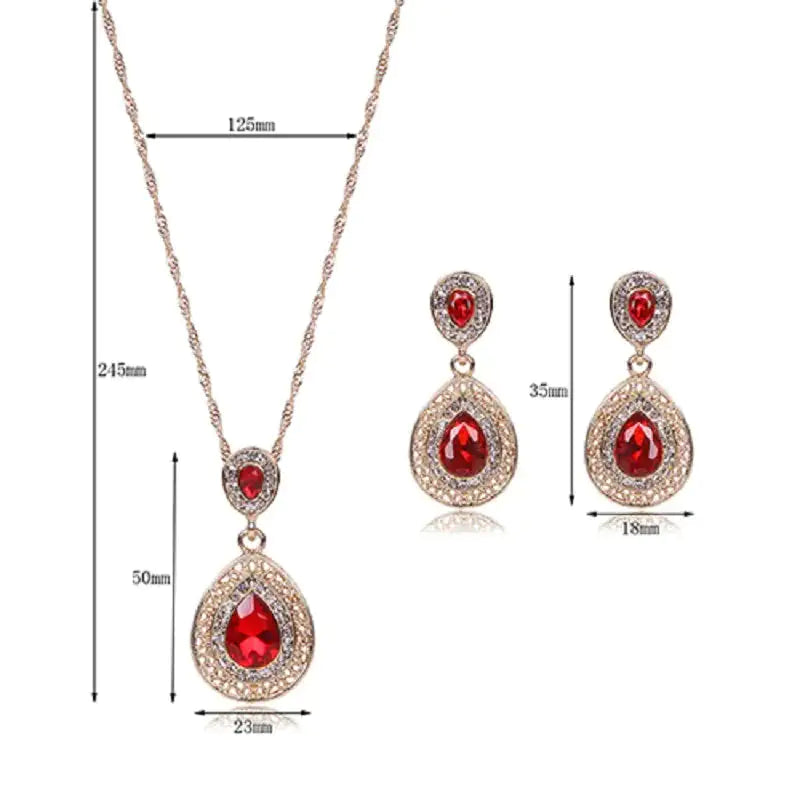 Red women jewelry set by Lamp Post featuring earrings, necklace, and bracelet with elegant design and shiny finish.