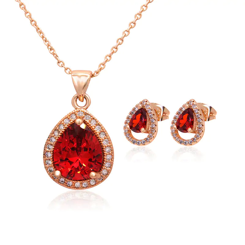 Red women jewelry set by Lamp Post featuring matching necklace and earrings with elegant design.