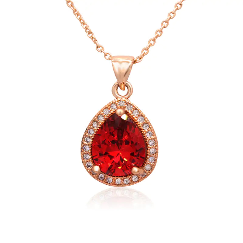 Red women jewelry set by Lamp Post featuring earrings and necklace with elegant design and intricate details.