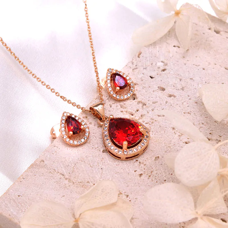 Red women jewelry set by Lamp Post featuring earrings and necklace with elegant design for stylish accessories