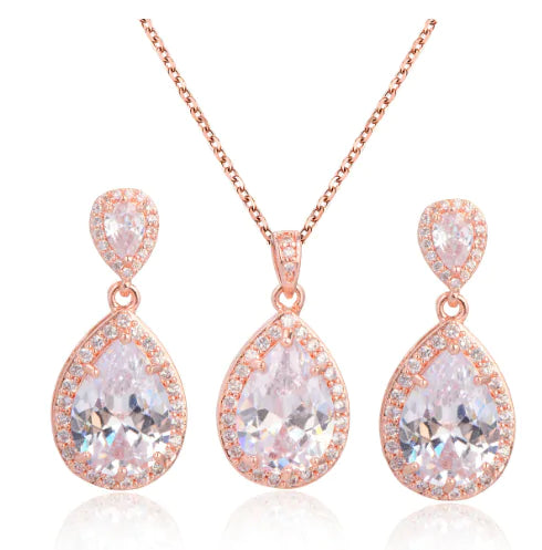 Red women jewelry set by Lamp Post featuring matching necklace and earrings with elegant design and shiny finish.