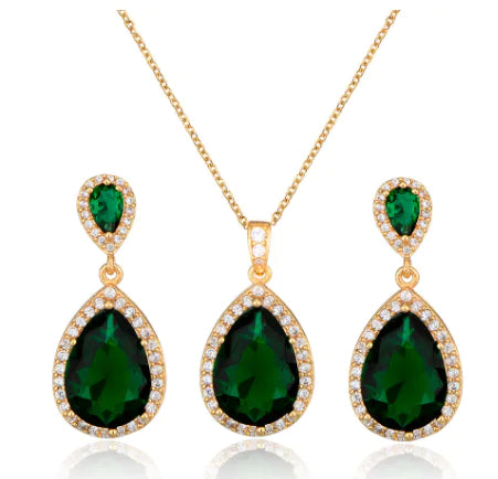 Red women's jewelry set by Lamp Post featuring earrings and necklace with elegant design and matching accessories.