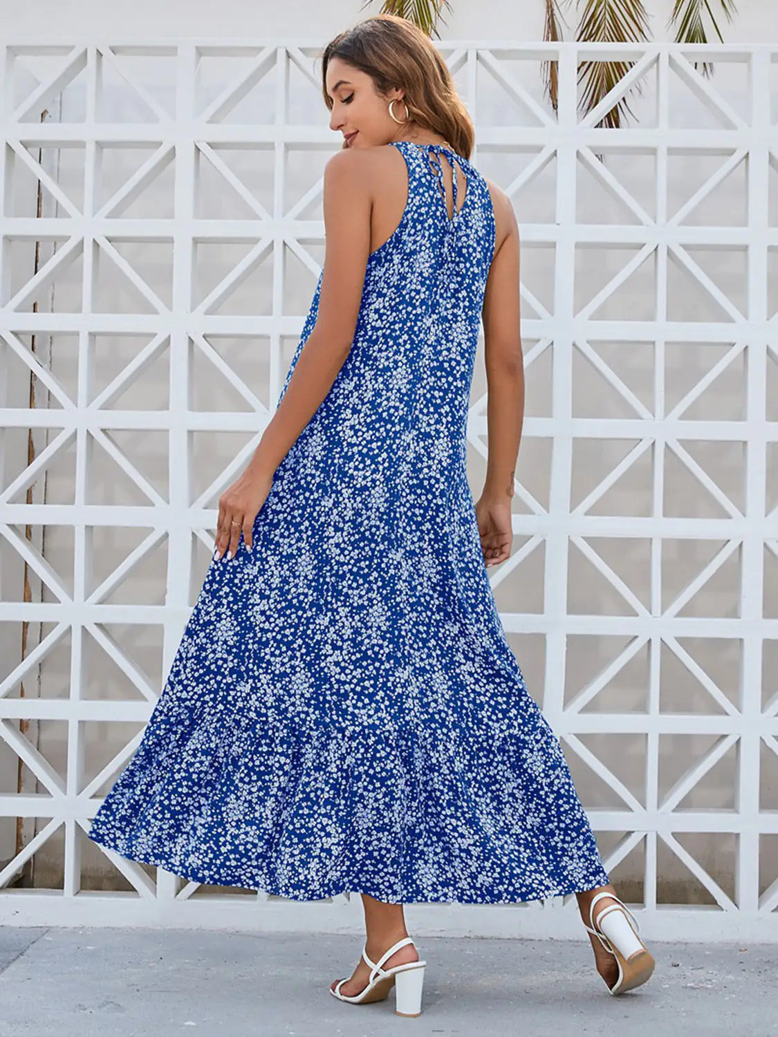 Lamp Post Ditsy Floral female dress in sage green, featuring a flowy silhouette and delicate floral pattern.