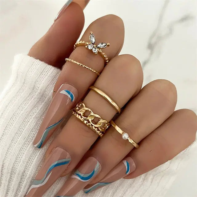 Set of 10 silver women rings from Lamp Post, featuring various stylish designs in a versatile jewelry collection.