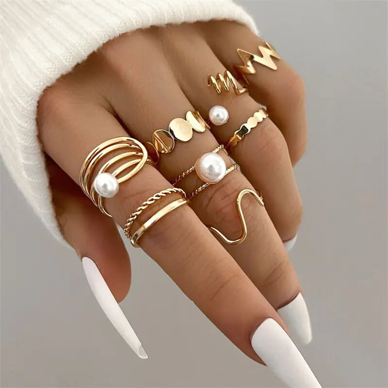 Set of ten silver women's rings by Lamp Post, featuring various stylish band designs for versatile jewelry looks.