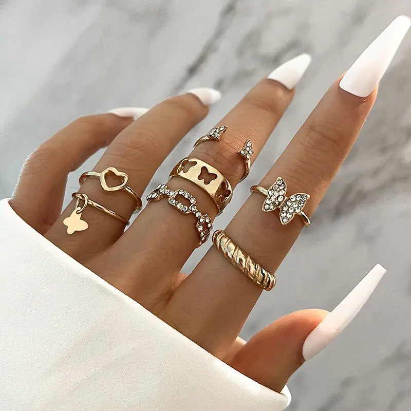 Set of ten silver women rings from Lamp Post, featuring various stylish designs in a silver jewelry collection.