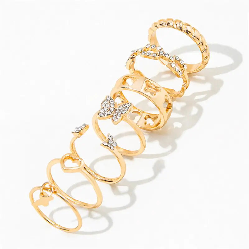 Set of ten silver women's rings from Lamp Post, featuring various stylish designs on a white background.