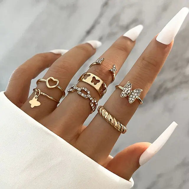 Set of 10 silver women's rings from Lamp Post featuring various stylish band designs and sizes.