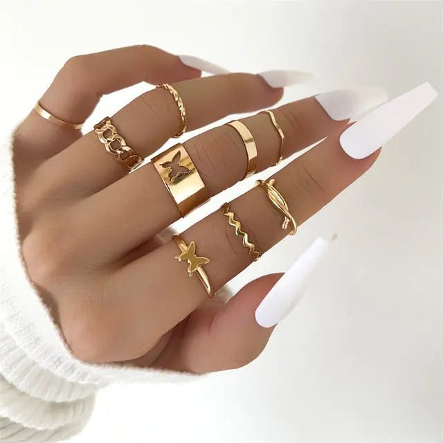 Set of 10 silver women's rings from Lamp Post featuring various stylish band designs and sizes.