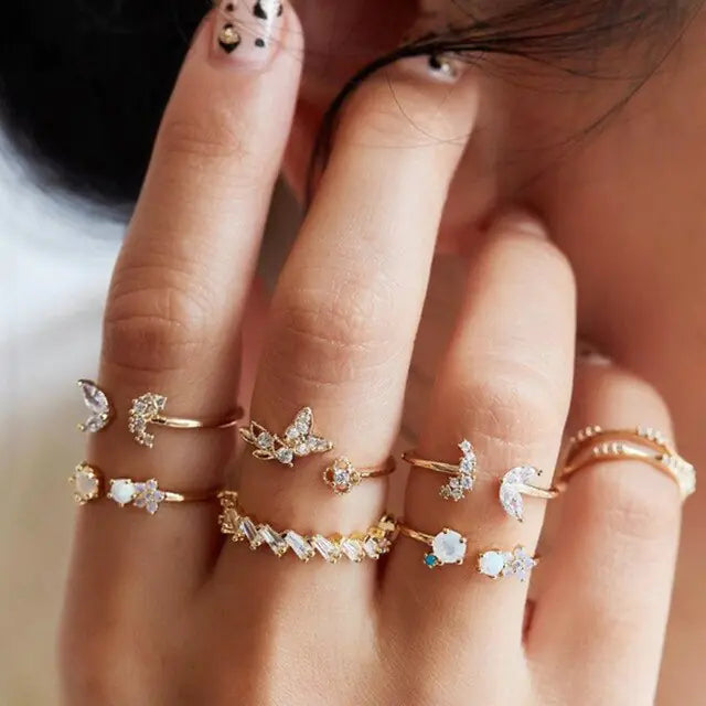 Set of ten silver women's rings from Lamp Post, featuring various stylish designs in a coordinated jewelry collection.