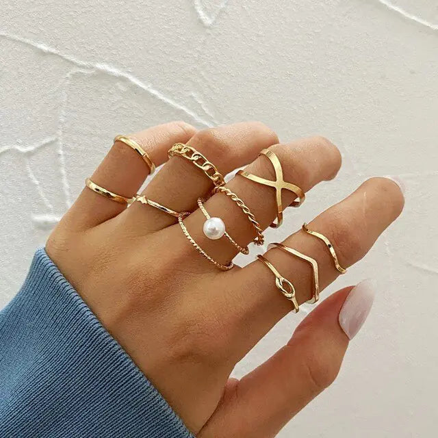 Set of ten silver women rings from Lamp Post, featuring various stylish band designs in a versatile jewelry collection.