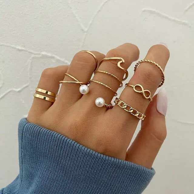 Set of 10 silver women's rings from Lamp Post, featuring various stylish band designs in a versatile jewelry collection.
