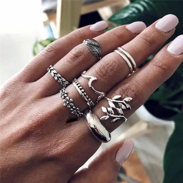 Set of 10 silver women's rings from Lamp Post featuring various stylish designs and sizes, perfect for layered or everyday wear.
