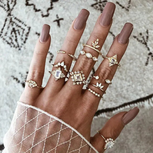 Set of 10 silver women rings from Lamp Post, featuring various stylish bands with intricate designs and polished finishes.