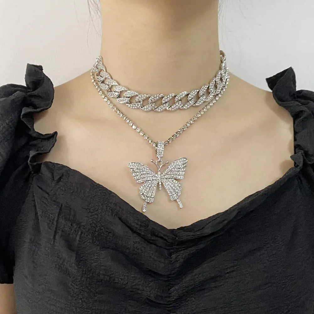 Silver women charm necklace set by Lamp Post featuring delicate chain and charming pendant details.