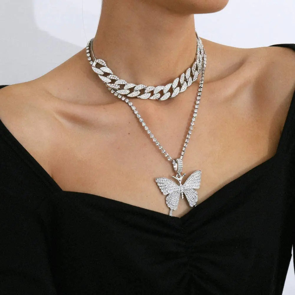 Silver women charm necklace set featuring delicate layered chains and small decorative charms, stylish jewelry by Lamp Post.