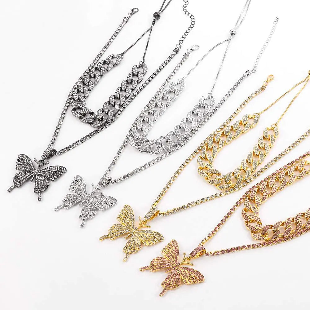 Silver women charm necklace set featuring delicate chains and decorative charms, perfect for versatile jewelry styling.