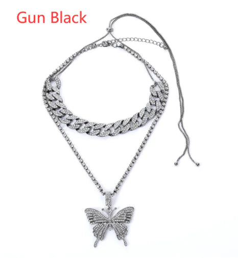 Silver women charm necklace set by Lamp Post featuring layered chains and delicate charms on a white background.