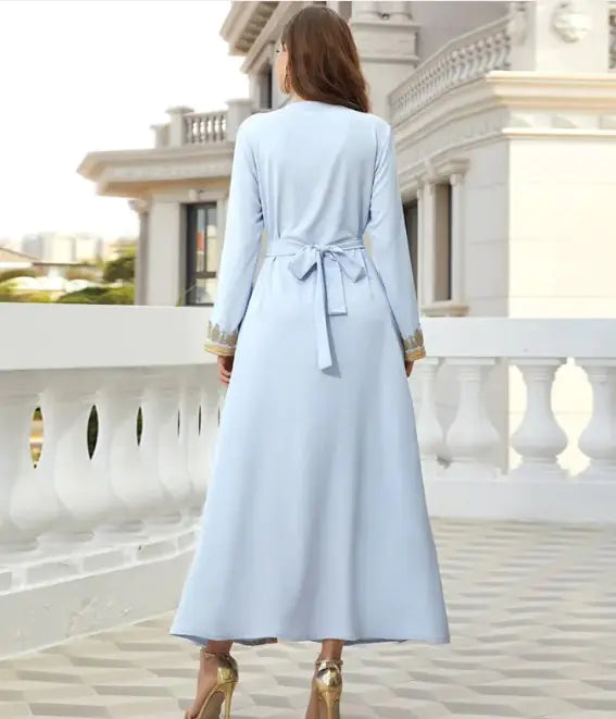 Small Lamp Post luxurious beads kaftan dress featuring intricate beadwork and flowing fabric, perfect for elegant occasions.