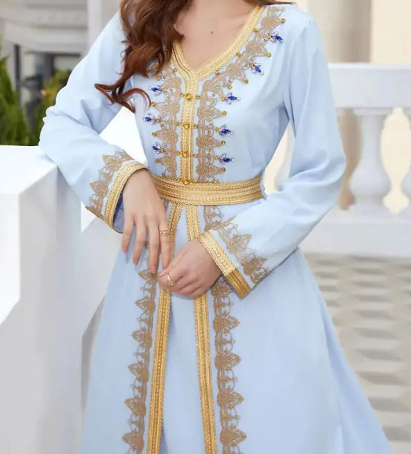Small Lamp Post luxurious beads kaftan dress featuring intricate bead embellishments and flowing fabric in vibrant colors.