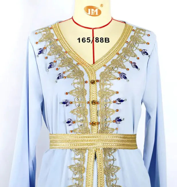 Small Lamp Post luxurious beads kaftan dress featuring intricate beadwork and flowing fabric in a vibrant, elegant design.