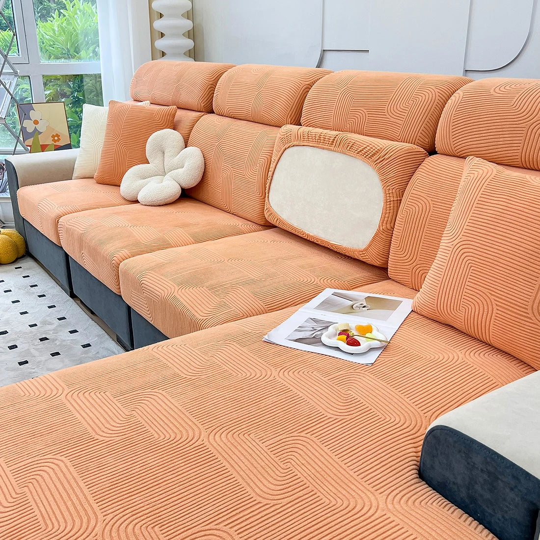 Lamp Post sofa seat cushion cover for living room, protective fabric slipcover on a L-shaped sofa, in a neutral color.