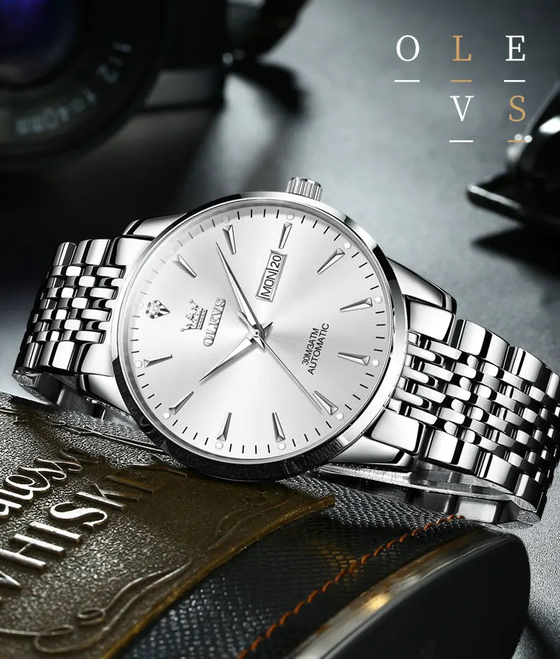 Gold stainless steel men's wristwatch with luminous dial, waterproof automatic movement, and date display by Lamp Post.