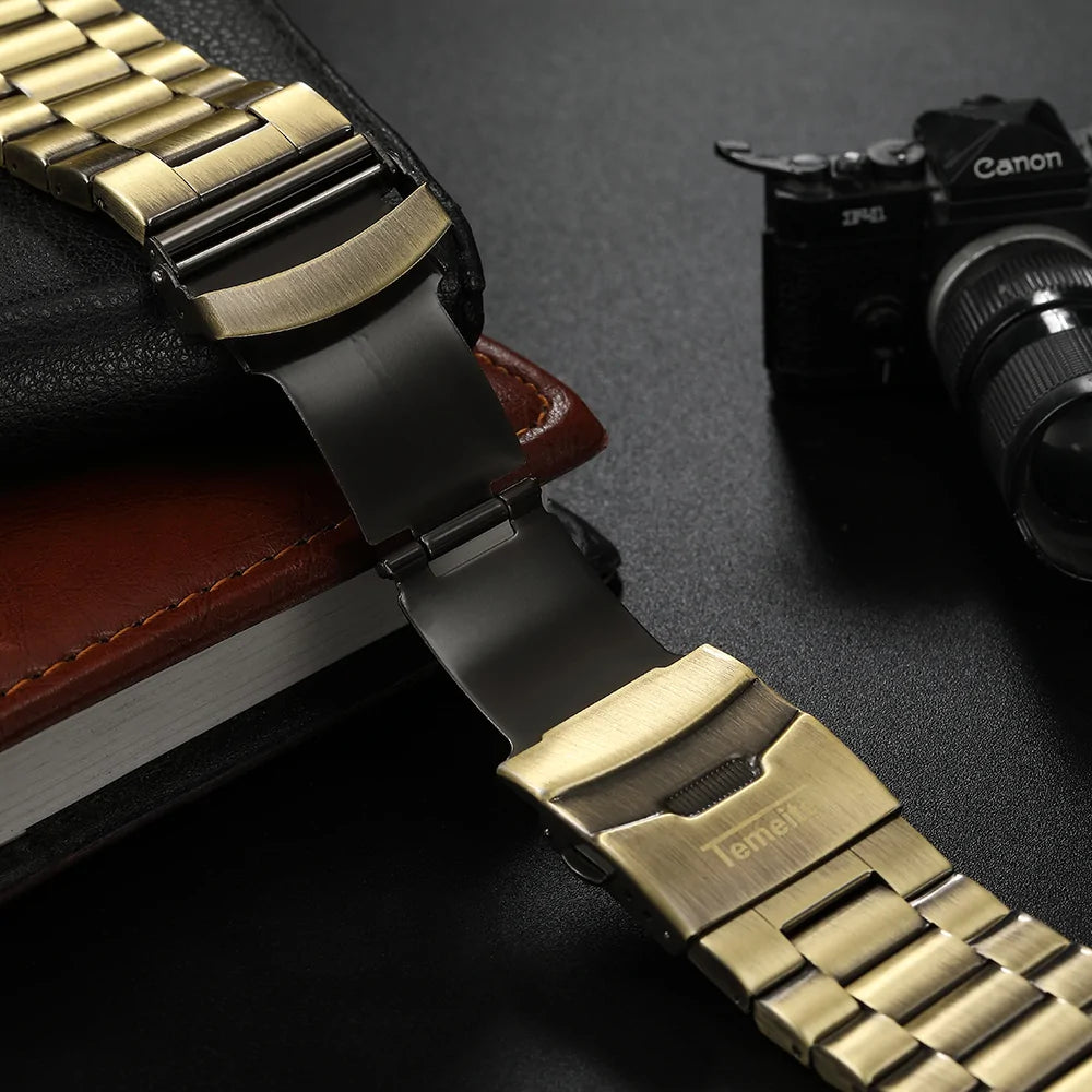 Three gold vintage men's Quartz watches by Lamp Post featuring classic designs and round dials with gold accents.