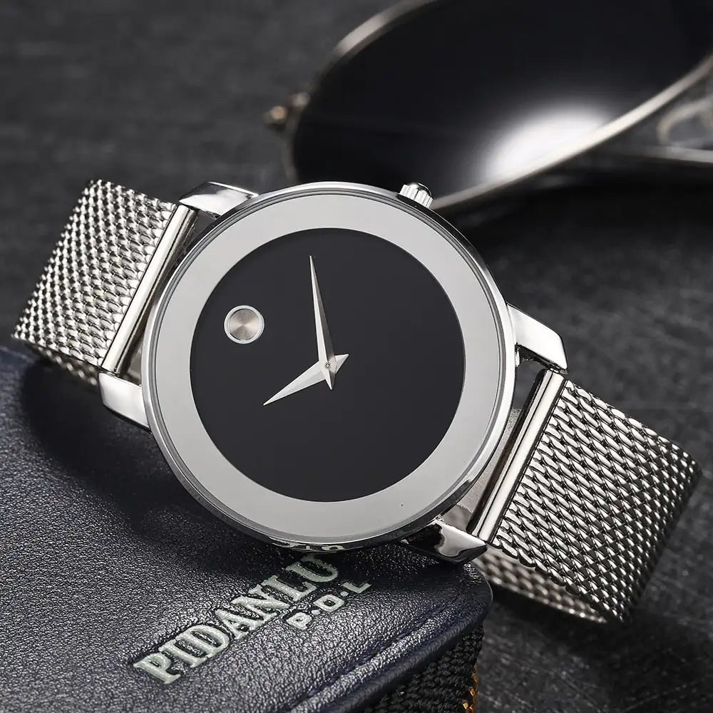 Silver minimalist Lamp Post watch for men and women with a sleek round dial and simple design.