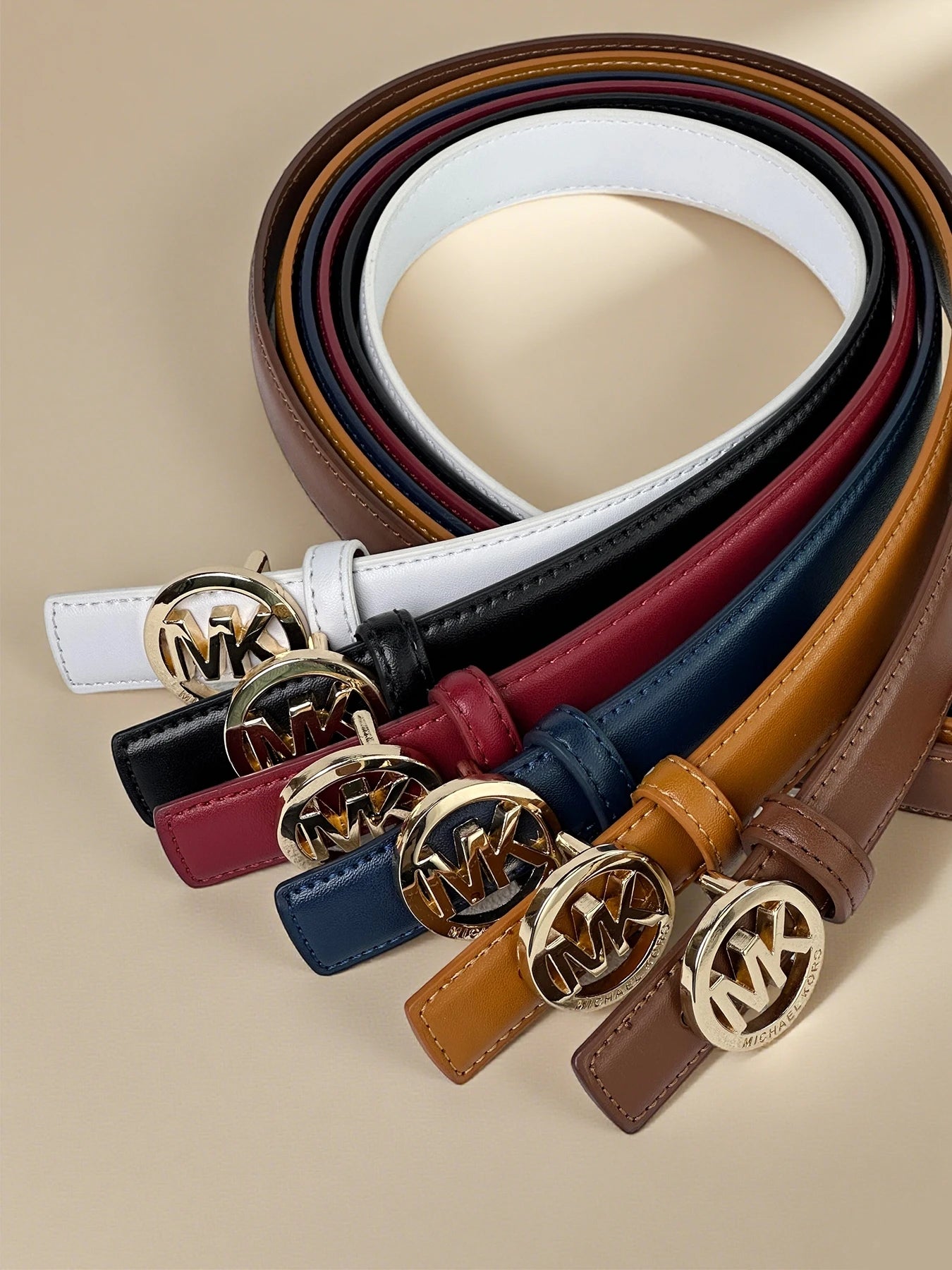 Elegant white women's belt with a letter buckle, featuring premium textured leather and modern style by Lamp Post.
