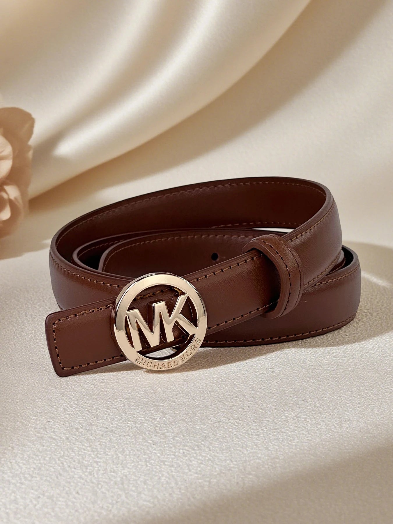 Elegant women's leather belt with letter buckle, premium textured finish and modern style, by Lamp Post.