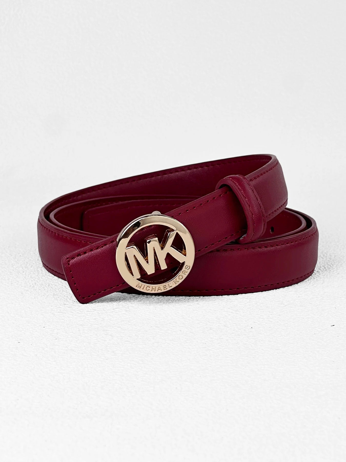 Elegant white women's belt by Lamp Post featuring a letter buckle, premium textured leather, and modern style.