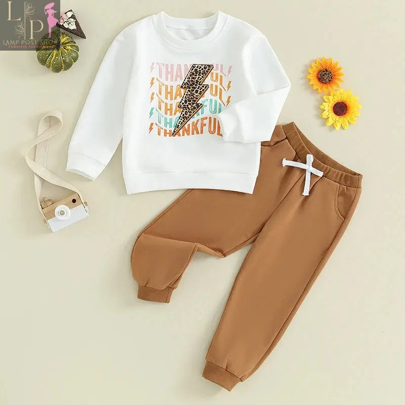 Baby girl or boy Thanksgiving outfit from Lamp Post, includes long sleeve T-shirt, crewneck sweatshirt, and long pants in white.
