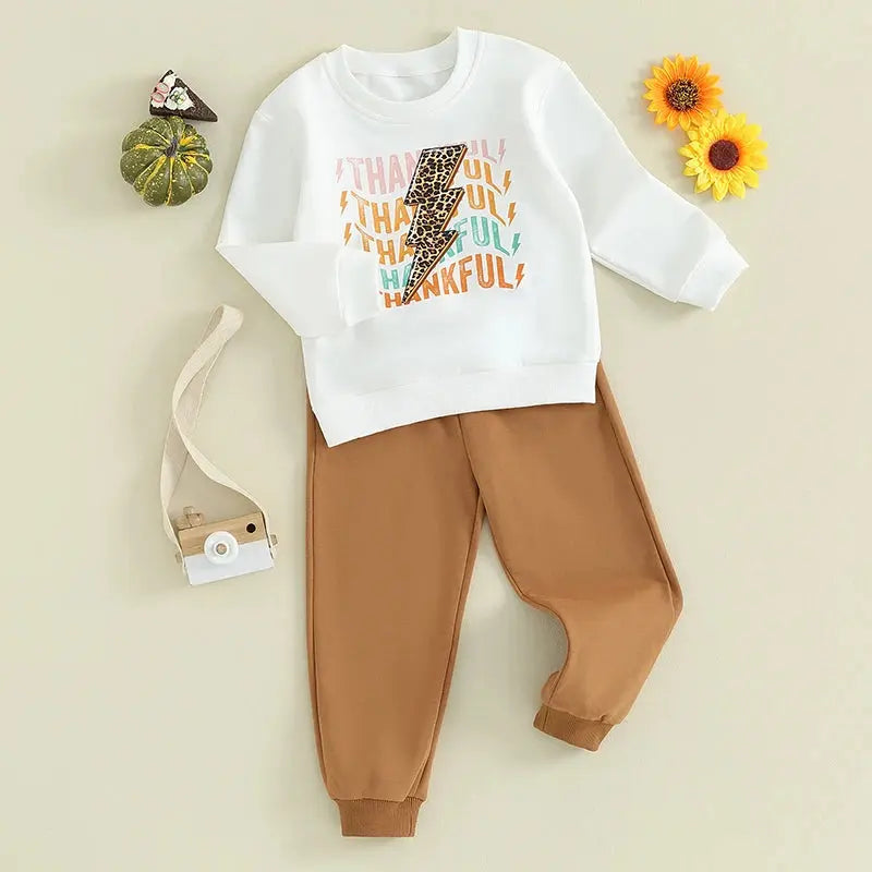 Baby girl or boy Thanksgiving outfit by Lamp Post, includes long sleeve T-shirt, crewneck sweatshirt, and long pants, in white.
