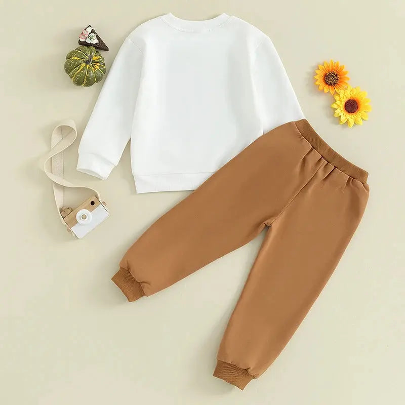 Lamp Post Thanksgiving outfit for 3-7 year old boys and girls featuring a long sleeve T-shirt, crewneck sweatshirt, and long pants.