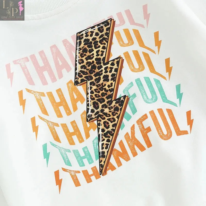 Baby girl and boy Thanksgiving outfit with white long sleeve T-shirt, crewneck sweatshirt, and long pants by Lamp Post.