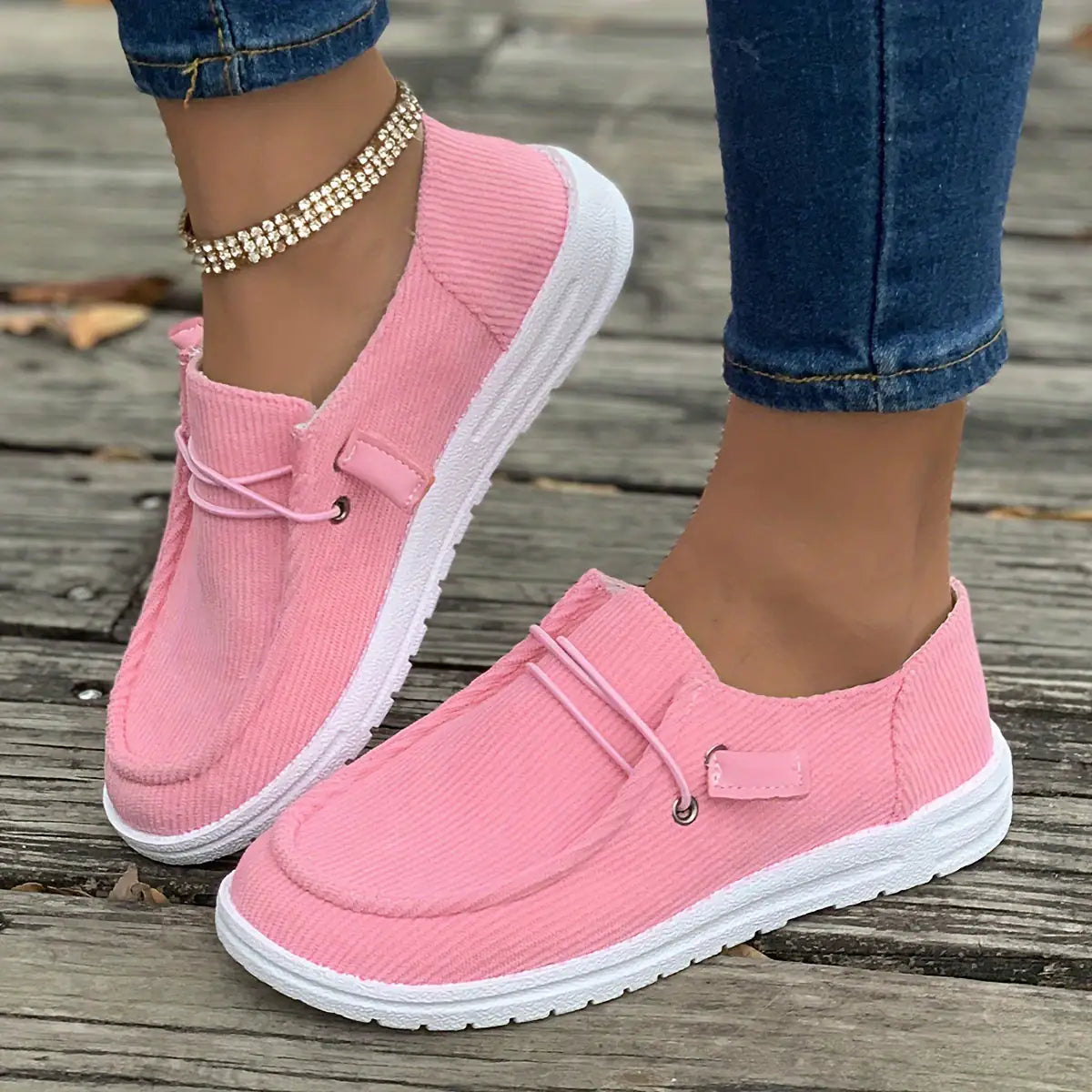 White non-slip women's sneakers by Lamp Post, showing comfortable slip-resistant athletic shoes with laces and cushioned soles.