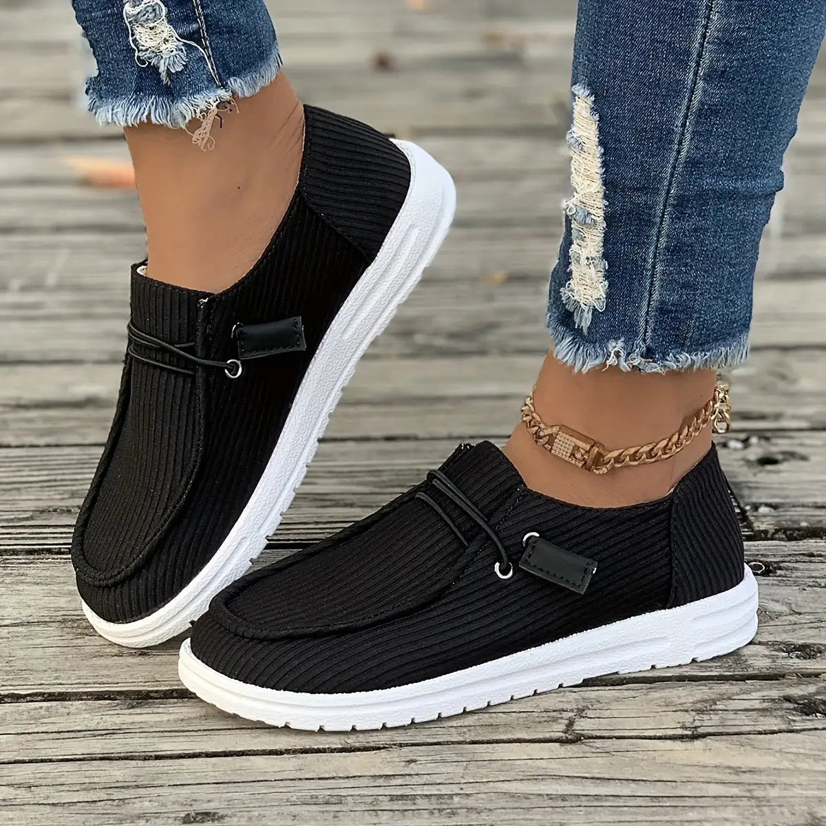 White non-slip women’s sneakers by Lamp Post featuring comfortable design and durable rubber sole for everyday wear.