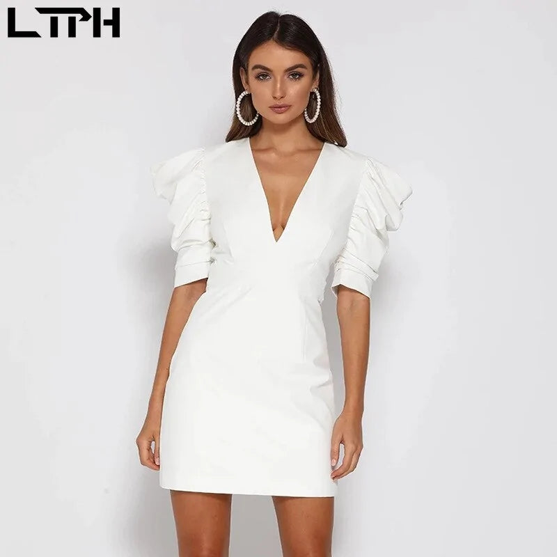 White spring new women’s dress by Lamp Post, featuring a stylish and lightweight design for warm weather.