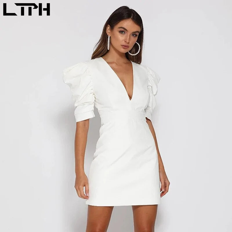 White spring new women’s dress by Lamp Post, featuring a lightweight, flowy design perfect for warm weather.