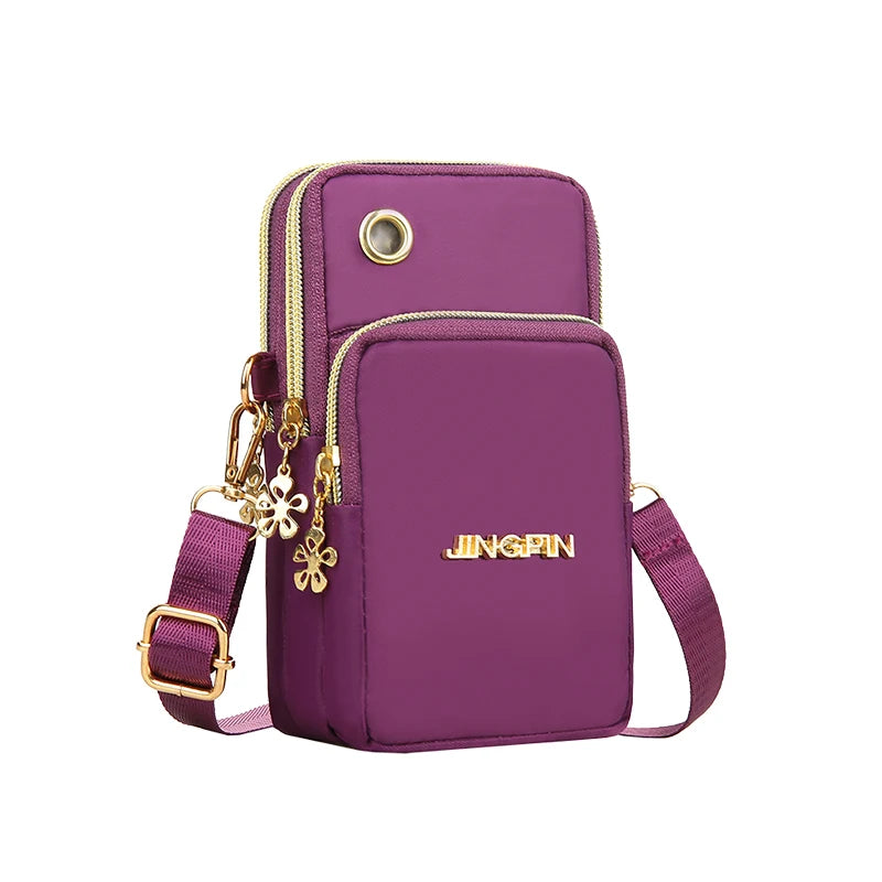 Black women's crossbody mini bag by Lamp Post, phone and coin bag with adjustable strap, suitable for running and daily use.