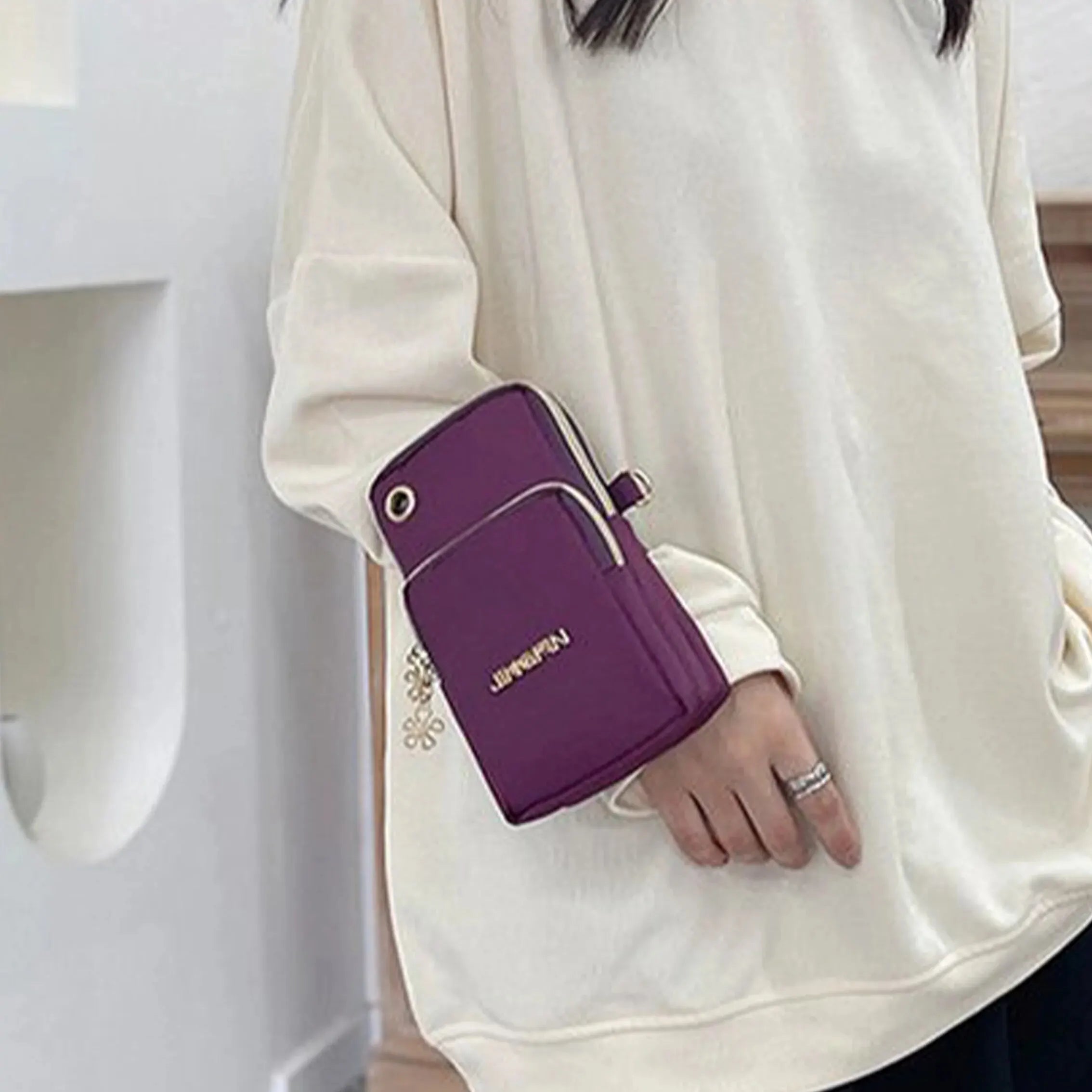 Black women's crossbody mini bag by Lamp Post, 20cm mobile phone bag with coin pocket and neck hanging style for running and daily use.