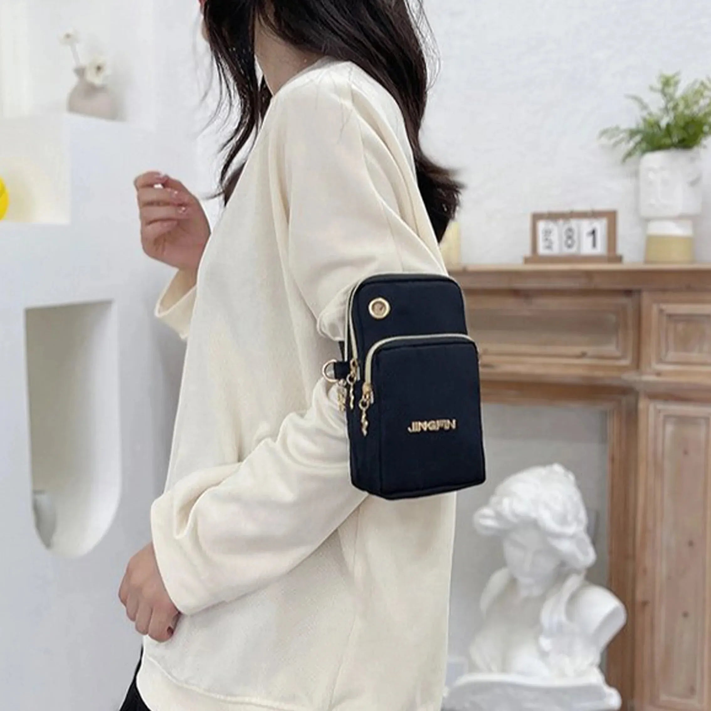 Black women's crossbody mini bag by Lamp Post, 2024 fashion phone and coin bag, with adjustable strap and neck hanging design.