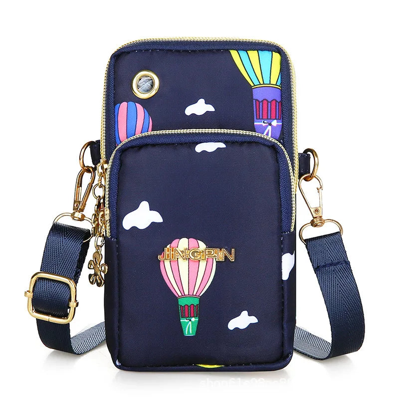 Black women's crossbody mini phone bag by Lamp Post, 20cm long, with coin pocket, suitable for running and everyday use.