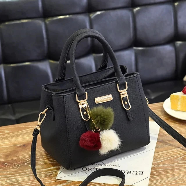 Black luxury women's crossbody handbag by Lamp Post with a sleek design and adjustable strap, measuring 31x14x23cm.