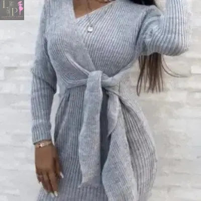Beige Lamp Post women's wrapover knitted mini dress in size XL, featuring a fitted silhouette and soft, textured knit fabric.
