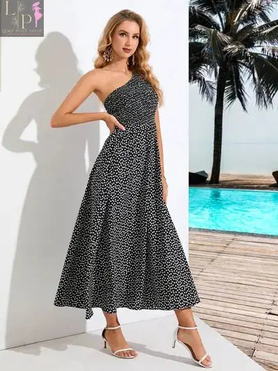 Black Zoe single shoulder dress for women by Lamp Post, stylish and elegant, shown on a model with a fitted silhouette.