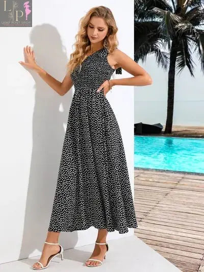 Black Zoe single shoulder dress for women by Lamp Post, displayed on a mannequin with elegant draping and a stylish fit.