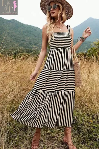 Black and white striped women’s Murry Tiered Dress by Lamp Post featuring a flowy, layered design.